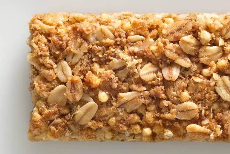 Nature Valley CA close-up of unwrapped Nature Valley Oats 'N Honey Crunchy Granola bar.